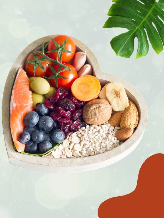 A heart-shaped bowl filled with Best probiotic for gut health-friendly foods like salmon, berries, oats, and nuts